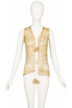 This unlabeled late-1960s vest is woven with real metal gold-tone thread that fastens in the front with rosette ties. It's sheer, with scalloped edges. It's in very good condition with some minor imperfections.  Measurements: Bust - 32"-36" Waist - 32"-36" IMPORTANT NOTE FOR CANADIAN SHOPPERS: There is a 15% shipping fee that is automatically applied to Canadian orders, as legally we need to charge and remit sales tax domestically. We will promptly refund any overcharge, and apologize for any in Elegant Sleeveless Gold Vest, Sleeveless Gold Top For Festival, Gold Sleeveless Top For Festival, Dream Wishlist, Timeless Basics, Daisy Jones, Late 1960s, Virtual Stylist, Avant Garde Fashion