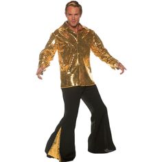 a man in gold jacket and black pants with his arms spread out, posing for the camera