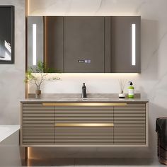 a bathroom with a sink, mirror and lights on the wall above it's counter