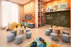 a child's playroom with toys and bookshelves