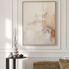 an abstract painting hangs on the wall above a table with vases in front of it