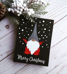 a christmas card with a gnome on it