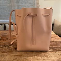 New With Tags! Pale Pink All Leather Mansur Gavriel Bucket Bag. Very Sweet, Understated Shade Of Pink. Comes With A Detachable Matching Mini Pouch And Dust Bag. Product Details: Made In Italy Adjustable And Detachable Shoulder Strap Drawstring Opening Height: 12.5in / 31.5cm Length: 9.75in / 25cm Depth: 7.5in / 19cm Strap Drop: 19in / 48cm Pink Leather Bucket Bag, Luxury Pink Bucket Bag For Everyday, Pink Leather Rectangular Bucket Bag, Pink Leather Bucket Bag With Removable Pouch, Pink Rectangular Leather Bucket Bag, Rectangular Pink Leather Bucket Bag, Pink Leather Shoulder Bag With Dust Bag, Pink Leather Bucket Bag For Daily Use, Modern Pink Bucket Bag With Detachable Strap