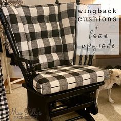 a black and white checkered chair with a dog on the floor in front of it