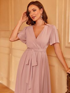 Product Code: FSWD1406 Embellishment: Chiffon Fabric: 100% Polyester Back Style: Zipper Up Fully Lined: Yes Built-in Bra: No Available Color: Pink Stretch: Moderate Fits true to size Imported Model Information: Height: 5' 2" Bust: 33.5'' Waist: 24“ Hips: 35.5” wearing US size Small Plunging Neck, Butterfly Sleeve, Butterfly Sleeves, Chiffon Fabric, Belted Dress, Wedding Guest, Pink Dress, Built In, Chiffon