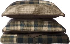 three pillows stacked on top of each other in front of a white background with the same plaid pattern