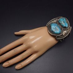 "VINTAGE NAVAJO BRACELET DESCRIPTION: This cuff features a pair of gorgeous Blue Diamond turquoise cabochons. The gemstones are secure in smooth bezel, on a foundation of heavy gauge vintage sterling silver. This bracelet will be a cherished addition to your collection of fine vintage Native American jewelry. MEASUREMENTS: Interior of the cuff measures 5 3/8\" with an additional 1 3/8\" slightly adjustable gap. Total circumference: 6 3/4\" Measures 2 3/8\" straight across the widest part of the Jewelry Measurements, Vintage Native American Jewelry, Navajo Bracelet, Turquoise Bracelet Cuff, Turquoise Cuff, Vintage Navajo, Denver Co, American Jewelry, Native American Jewelry