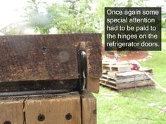 an old wooden box sitting in the grass