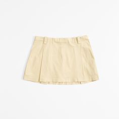 Mid rise mini skort in our crisp chino fabric, featuring belt loops, all-over pleating details, shorts lining for comfort and side zipper for a secure fit. Women's Bottoms, American Clothing, Sunny Yellow, Suits Coats, Athletic Fits, New Arrival Dress, Swimwear Accessories, Abercrombie Fitch, Side Zipper