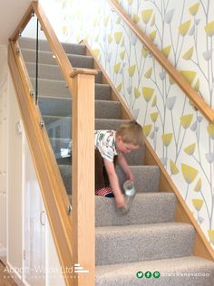 a little boy that is standing on some stairs