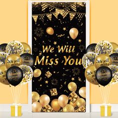 we will miss you balloons and streamers in front of a door with gold foil decorations