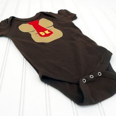 This adorable Donkey Kong inspired bodysuit is made of a soft, borwn, 100% cotton in the size of your choice. The donkey Kong chest and tie are cut of cotton fabric, ironed on, and then sewn around the edges for durability. The bodysuit has a satin heart on the rear end. Bottoms up!These are Rabbit Skins brand bodysuits. Newborn 5 – 10 lbs6 Months 11–14 lbs12 Months 15–20 lbs18 Months 21–24 lbsGreat baby shower gift or to take along to meet that new little one! Donkey Kong Costume, Great Halloween Costumes, Rear End, The Donkey, Halloween 2024, Donkey Kong, Second Baby, Baby Costumes, Halloween Cosplay