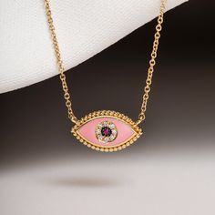 MELIGreece's lovely feminine chain necklace made of 18k yellow gold, a pink enamel eye with dotted surrounding, one central natural ruby weighting 0.01 cts. framed with natural diamonds weight in total : 0.03 cts. Dimensions of the eye charm : 1.7 cm. * 7.0 mm. / 0.67 - 0.27 inch. Length of the pink ruby diamond eye chain necklace : 39. 0 - 42. 0 cm. / 15.35 - 16.53 inch. A special gift proposal for this spring, accompanied by a stylish jewelry box and gift packaging. We combine it with MELIGree Yellow Gold Evil Eye Jewelry, Pink Pendant Charm Necklace With Delicate Chain, Pink Enamel Pendant Necklaces, Pink Pendant Necklace In Enamel, Pink Fine Jewelry As Gift For Her, Pink Necklace With Adjustable Chain For Her, Pink Enamel Charm Necklace, Pink Gold-plated Jewelry With Adjustable Chain, Pink Enamel Necklaces With Charms