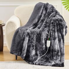 an electric blanket sitting on top of a couch