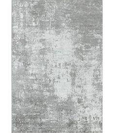 an area rug with grey and white colors