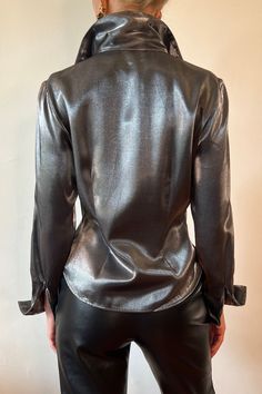 Chic Shiny Tops For Fall, Modern Fall Blouse For Night Out, Modern Blouse For Night Out In Fall, Modern Blouse For Fall Night Out, Chic Metallic Shine Tops, Chic Metallic Tops With Shine Detail, Glamorous Shiny Top For Fall, Glamorous Fitted Office Tops, Fitted Shiny Chic Tops