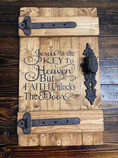 a wooden plaque with an iron handle on it that says jesus is the key to heaven but all he unlocks the door