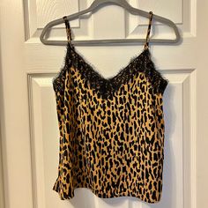 Brand New Condition Nordstrom Bp Leopard Print Lace Camisole Size Small. This Camisole Has A Silky Feel To It. It Features A V Neckline In Both The Front And Back That Is Trimmed With A Beautiful Border Of Black Lace. This Has Adjustable Straps And Two Small Slits In Either Side Of The Bottom. This Can Be Dressed Up Or Down To Create A Variety Of Looks! This Is Also Available In Floral Print In My Closet. Feel Free To Make Me An Offer Or To Make A Bundle For Deeper Discounts. Thank You For Stopp Spring Leopard Print Camisole Top, Leopard Print Camisole Top For Spring, Brown Camisole Tops For Night Out, Nordstrom Sleeveless Summer Tops, Nordstrom Sleeveless Tops For Summer, Nordstrom V-neck Tops, Nordstrom Sleeveless Tops For Spring, Casual Sleeveless Tops From Nordstrom, Lace Camisole