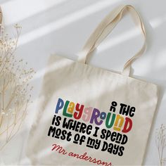 a tote bag with the words playground is where i spend most of my days