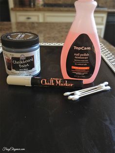 the contents of a nail polish remover, toothpaste and other items on a tray