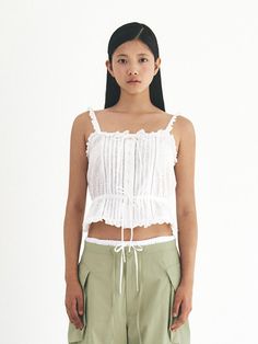 This is a casual and trendy top by grove that is made out of high quality and sturdy material. With distinctive mood of the design and comfortable wear, you can style it for your casual daily outfit.- Set up with matching skirt pants- Lace frill and pin tuck detail- Casual and feminine mood Spring Relaxed Fit Crop Top Tank Top, Chic Relaxed Fit Cotton Tank Top, Chic Cotton Camisole Crop Top, Chic Cotton Tank Top For Spring, Spring Cotton Crop Top For Daywear, Relaxed Fit Sleeveless Crop Top, Cotton Tank Blouse For Day Out, Cotton Sleeveless Blouse Tank Top For Day Out, Chic Cotton Tank Crop Top