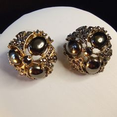 Listing Is For A Pair Of Earrings That Is Silver. It Has Faux Gray To Black Pearl Surrounded By Marcasite. Please See Photos For Measurement. This Is Not A Brand New Item. And It Is Not On Sterling. Please Visit My Closet For More Vintage Items, Gems On Silver, Bracelets, Necklace Sets Made With Swarovski Xirius Crystals On Brass And Gunmetal. Thank You. Evening Round Metal Clip-on Earrings, Evening Round Clip-on Metal Earrings, Metal Round Clip-on Earrings For Evening, Black Metal Costume Jewelry Earrings, Silver Clip-on Cluster Earrings For Evening, Metal Clip-on Crystal Earrings For Evening, Evening Metal Clip-on Crystal Earrings, Elegant Evening Metal Crystal Clip-on Earrings, Silver Marcasite Jewelry With Gemstone