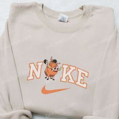 Introducing the Pumbaa x Nike Cartoon Embroidered Sweatshirt, a playful fusion of style and comfort. Made with premium quality materials, Nike Cartoon, Nike Inspired, Embroidered Apparel, Best Family Gifts, Mike Wazowski, Shirt Nike, Daisy Duck, Hoodie Material, Custom Nikes