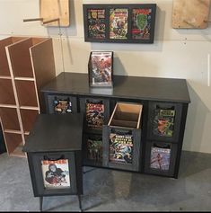 an entertainment center with comic books on it