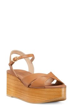 A chunky woodgrain platform and lofty wedge heel add statement-making height to a stylish sandal fitted with an adjustable strap at the ankle. 3" heel; 1 1/2" platform (size 8.5) Adjustable ankle strap with buckle closure Textile or leather upper/synthetic lining/leather and synthetic sole Made in Spain Stylish Sandals, Wedge Sandal, Sandal Women, Stuart Weitzman, Flat Sandals, Wedge Heels, Wedge Sandals, Women's Shoes Sandals, Nordstrom Rack