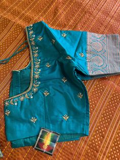 This is a beautiful Pure Kanchi Pattu Powerloom Silk saree . Blouse designed and stitched very neatly.  blouse also have beautiful hand Maggam work on its back ❤️ Material used Kanchi Soft silk and Copper zari weaving allover. Blouse designed stitched and can fit any size between 36-44 inches chest. Note- if you need blouse size to be adjusted to fit please let me know in message after order, I would love to do alteration for you. Ships immediately. Pattu Blouse Stitching Designs, Hand Thread Embroidered Blouse Designs, Blue Cutdana Blouse For Eid, Festive Zari Weaving Blouse For Puja, Designer Tussar Silk Choli With Dori Work, Zari Weaving Blouse For Eid, Traditional Blouse With Zari Weaving For Festive Occasions, Festive Zari Weaving Blouse For Traditional Ceremonies, Festive Traditional Blouse With Zari Weaving