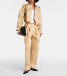 Cropped cotton gabardine jacket in beige - Victoria Beckham | Mytheresa Spring Blazer With Belted Cuffs And Lapel Collar, Elegant Cotton Outerwear With Belted Cuffs, Spring Double-breasted Blazer With Belted Cuffs, Chic Gabardine Outerwear With Belted Cuffs, Belted Gabardine Outerwear For Work, Classic Spring Blazer With Belted Cuffs, Classic Blazer With Belted Cuffs For Spring, Chic Outerwear With Belt Loops For Work, Chic Cotton Blazer With Notch Lapel