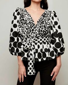 Pair this with your favorite jeans and slides for your next girls night out. Off-the-shoulder and on-trend. Chic mix print blouse. True to size. Machine washable. ALBERTO MAKALI Puff-Sleeve Blouse in Black/White | Black/White | Materials & Care Instructions: ['100% Polyester', 'Imported'] Chic V-neck Top With Bold Print, Chic V-neck Blouse With Graphic Print, White Trendy Tops With Blouson Sleeves, Trendy White Tops With Blouson Sleeves, Casual Printed Blouse For Party, Trendy Printed Blouse For Day Out, Chic Blouse With Bold Print, Chic Tops With Bold Print For Spring, Chic V-neck Tops With Bold Print