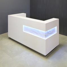 a white reception table with blue lights on the front and back sides, in an office setting