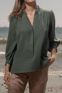 MARISH TOP The MARISH - made from our signature lightweight cotton gauze, this breezy top exudes casual elegance, making it the perfect choice for warm days and balmy nights. Designed with the relaxed coastal lifestyle in mind, the MARISH Top wears beautifully. Gauze Button Front Blouse 3/4 Slight Bishop Sleeve Button Cuff Mandarin Collar Front Gathers at Yoke Covered Placket Fabric: Double Cotton Gauze Lining: Unlined Care : Dry Clean Made in California Model is 5'9 and wearing size S Coastal Lifestyle, Double Gaze, Fall Denim, Bishop Sleeve, Fall Favorites, Kids Hats, Casual Elegance, Mandarin Collar, Socks For Sale