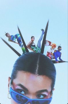 a woman with her hair in the air and several pairs of scissors sticking out of her head