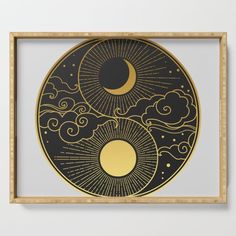 the sun, moon and clouds are depicted in this black and gold artwork serving tray