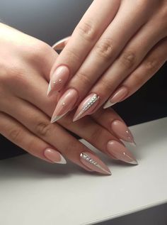 Fancy Nails Almond Shape, Edgy Nails Almond Shape, Two Finger Nail Design, Nude Nails With Design Almond, Nails With Stones Ideas, Almond Nails Nude Design, New Years Almond Shaped Nails, Almond Shaped Nails With Rhinestones, Almond Nails With Bling