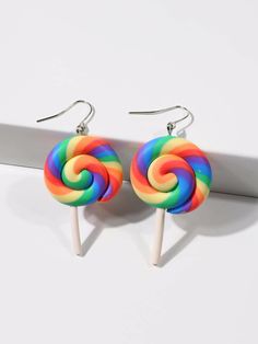 two lollipops sitting on top of each other in front of a white background