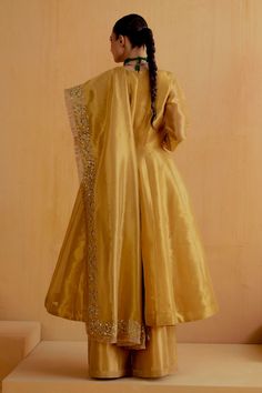 Gold tissue silk kalidar kurta. Paired with a wide legged pant and floral zardosi embroidered dupatta. - Aza Fashions Gold Slub Silk Anarkali Set, Silk Anarkali Set With Straight Kurta And Pallu, Elegant Tussar Silk Anarkali Set With Dabka, Gold Floor-length Kurta With Sheer Dupatta, Silk Anarkali Kurta With Traditional Drape, Gold Slub Silk Churidar For Wedding, Silk Anarkali Set With Traditional Drape For Eid, Floor-length Raw Silk Traditional Wear With Sheer Dupatta, Gold Silk Anarkali Set