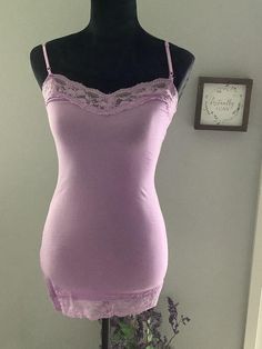 Product Description: This Royal lace camisole is sleeveless with adjustable straps. It is slim fitting and extra long in length. The fabric is a combination of 95% cotton and 5% spandex. It is best to care for by hand washing and laying flat to dry. This basic Royal Lace trim Cami comes in an array of colors, just in time the season change , pairs well with a cardigan, jacket, or can be used as a layering piece now in new seasonal colors.. This Cami is a sexy lingerie top to wear with any bottom Lace Cami Top Outfit, Cami Top Outfit, Lace Undershirt, Season Change, Cami Outfit, Lingerie Top, Lace Trim Cami, Fits Inspo, Lace Cami Top