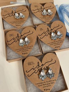 six heart shaped boxes with wedding favors in them