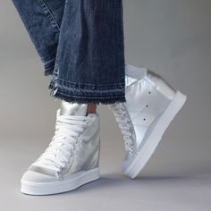 Buy Fearless Silver Wedge Sneaker | Shop Luxury Shoes | CynthiaRichard White Lace-up Wedge Sneakers For Streetwear, Luxury Low-top White Wedge Sneakers, Luxury White Low-top Wedge Sneakers, Breathable High-top Synthetic Wedge Sneakers, High-top Synthetic Wedge Sneakers, White Wedge Sneakers, Fancy Sneakers, Silver Wedges, Hidden Wedge Sneakers