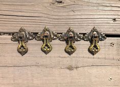 an old wooden door with ornate brass handles