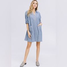 Brand: Crescent Description: Striped Denim Shirt Dress With Button Down Collar Featuring Pocket Detail And Cuffed Sleeves. Color: Denim Blue Care: Hand Wash Recommended Model Is 5'8" Tall And Wearing Size S Material: 100% Cotton Measurements Flat Lay Bust: 21.5 In Shoulders: 16.5 In Length: 35 In Light Wash Relaxed Fit Shirt Dress For Summer, Casual Shirt Dress With Placket For Spring, Summer Light Wash Relaxed Fit Shirt Dress, Spring Shirt Dress With Roll-up Sleeves And Relaxed Fit, Casual Cotton Shirt Dress With Roll-up Sleeves, Cotton Shirt Dress With Roll-up Sleeves For Summer, Spring Shirt Dress With Rolled Sleeves For Day Out, Blue Casual Cotton Shirt Dress, Casual Blue Cotton Shirt Dress