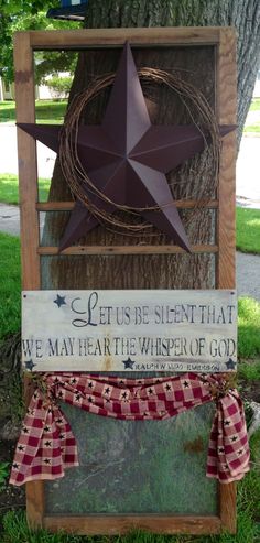 a wooden sign that says let us be silent that we may hear the whisper of god