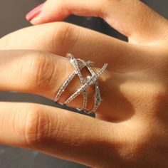 KNOT CRISSCROSS RING ✨💎 May this ring... Find your special someone in a complex and intersecting path. ✨ 🚩 DOUBLE SHINING! 🚩 DOUBLE SPARKLING! 🚩 DOUBLE VALUE! * Heavy Rhodium plating over Sterling Silver * Top Grade 5A Cubic Zirconia Diamond Alternatives 👍 Recommendations * As an everyday ring * As a travel wedding band ✈ * As an anniversary ring for couples 🎁 💎 Features Inspired by a vine knot, a Crisscross ring in a modern way. * FACE HEIGHT: 17mm (0.7 inches) * SKU: SMYC0025R ⭐ ⭐ ⭐ ⭐ ⭐ Crisscross Ring, Ring Redesign, Criss Cross Ring, Silver Top, Zierlicher Ring, Everyday Ring, Diamond Alternatives, Writing Gifts, Statement Ring Silver