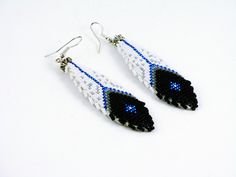 Feather Earrings are 3" long including the ear wire. The great thing about beadwork earrings is they are very light weight, even when 3".  The smooth leather backing is sewn by hand to the beadwork. Available and in stock.  3 INCH LONG FEATHER EARRINGS. Note - these are the tiniest beads, (which are the hardest to create with, of course.)  The Feather Earrings and the Cuff are Sold Separately.  You may purchase the Cuff Bracelet OR the Feather Earrings OR Both.  Feather Earrings are 3" long incl Beaded Feather, Beaded Feather Earrings, American Quilts Patterns, Native American Beadwork Patterns, Twin Beads, Jewelry Making Earrings, Native American Beaded Earrings, Beaded Earrings Tutorials, Beaded Cuff Bracelet