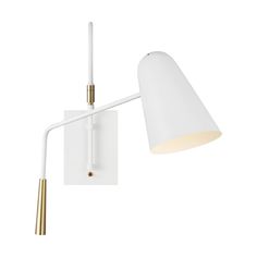 a white wall light with a gold arm and a white shade on the back of it