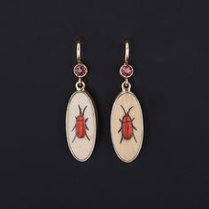 Add a touch of edge to any ensemble with these fun insect earrings! To create these earrings, our jeweler carefully cut antique shibayama game pieces (circa 1880) into an oval shape, mounted them in 14k gold, and added 14k ear wires and ruby surmounts. Each earring measures 1.1 inches from the top of the ear wire to bottom by 0.3 inches wide, and they are in excellent condition. We have many other fantastic offerings of period fine jewelry posted on our Etsy store, so please consider browsing ou Victorian Oval Pierced Earrings, Victorian Oval Earrings For Collectors, Collectible Victorian Oval Earrings, Antique Brass Oval Earrings, Antique Oval Earrings For Collectors, Antique Oval Brass Earrings, Oval Brass Earrings For Formal Occasions, Antique Oval Collectible Earrings, Oval Intaglio Earrings As A Gift