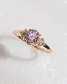 a close up of a ring on a white surface